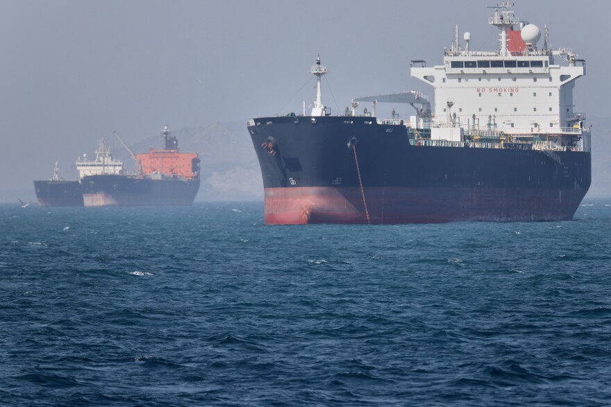 Oil tankers sit at anchor offshore in the Strait of Hormuz off Bandar Abbas, Iran, Saturday, May 2, 2026. (Amirhosein Khorgooi/ISNA via AP)