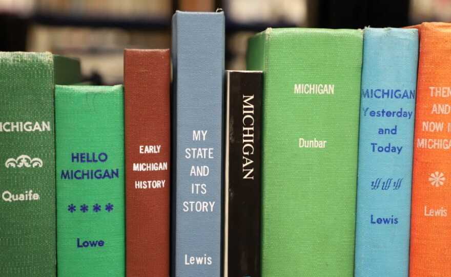 A photo of several books about Michigan history. 
