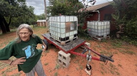 Cedar Lake resident Belinda Smith talks about her 275-gallon water tank donated by neighbors at her rented house on Thursday, July 16, 2026. Smith hasn't had reliable running water for two years but can't afford to move.