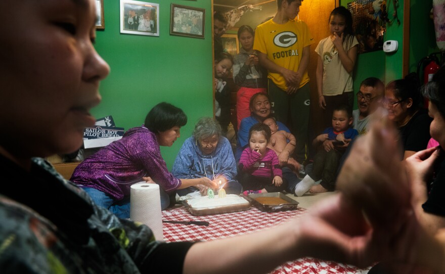 Lizzie Chimiugak Nenguryarr's family gathers to celebrate her 90th birthday at her home in Toksook Bay. She was the first person counted for the 2020 census.