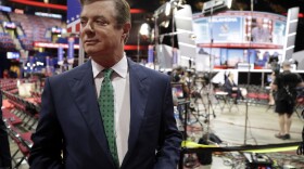 In this photo taken July 17, 2016, Paul Manafort talks to reporters on the floor of the Republican National Convention at Quicken Loans Arena in Cleveland. Lately, special prosecutor Robert Mueller has been ratcheting up pressure on Manafort.  (Matt Rourke/AP)
