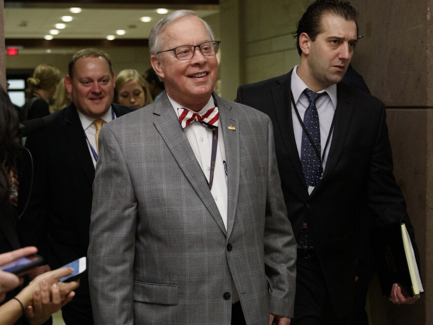 FILE - U.S. Rep. Ron Wright, R-Texas, walks to a session during member-elect briefings and orientation on Capitol Hill in Washington, Thursday, Nov. 15, 2018. Wright was admitted to a Dallas hospital due to complications surrounding his cancer treatment, his campaign said Monday, Sept. 14, 2020. Wright, 67-year-old Republican, was elected in 2018 to Texas' 6th congressional district in Arlington. His campaign said in a statement that Wright has “been in a tough battle with cancer this year.” (AP Photo/Carolyn Kaster)