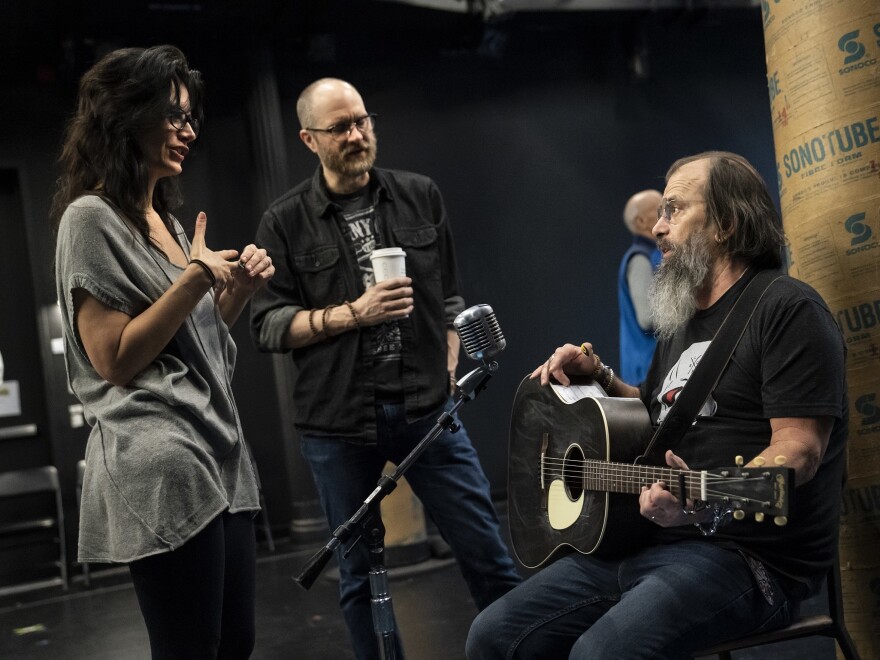 Playwrights Jessica Blank and Erik Jensen talk with Steve Earle during rehearsals.