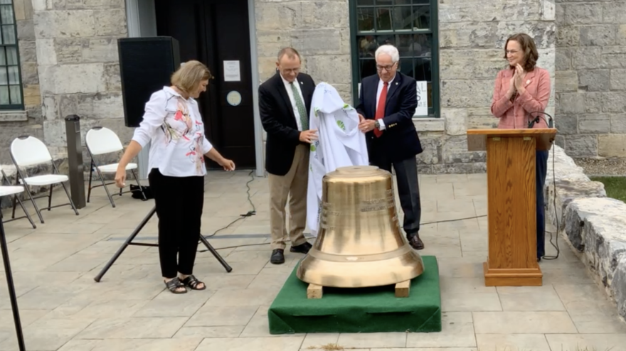 Betsy Fantone, Brad Jones, Menzo Case and Jennifer Gabriel unveil the half-size replica of the Justice Bell at Seneca Falls on Wednesday.