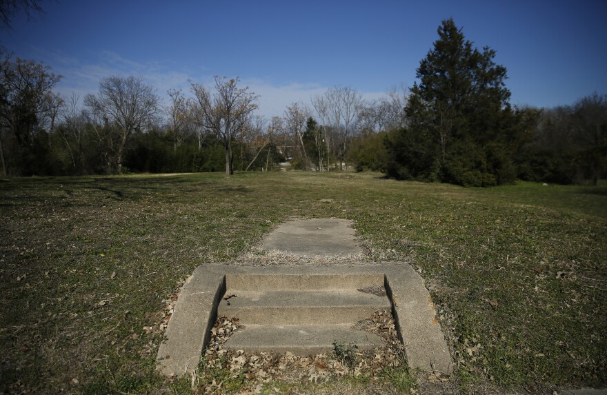 Old homes have been torn down along North St. in the Tenth Street Historic District east of I-35E.  