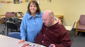 Martha Chisam and her son Danny pose for a photo at the Life Center in Brockton, Massachusetts, a nonprofit that provides services for adults with disabilities. Martha has been Danny's primary caregiver since her husband died 20 years ago.