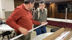 A Louisville Climate Action volunteer speaks about LED lights with a church member at St. Stephens United Church of Christ in Shiveley.