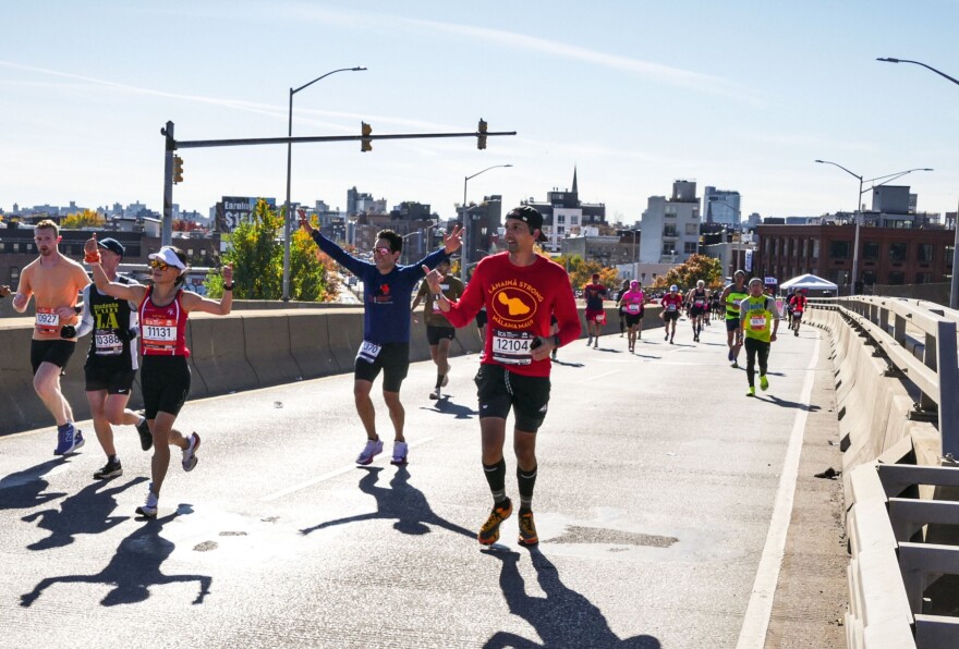 Nate Kahaialiʻi, center in red, just completed the New York City Marathon with a sub-four-hour time, getting shakas and cheers for Lahaina along the way. (Nov. 3, 2024)