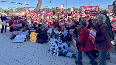 UMC Nurses gather outside the hospital on Tuesday, November 11, 2025, in New Orleans. The nurses are striking for three days, asking hospital administrators to negotiate new staff contracts that prioritize staff retention, which they say can improve patient care and safety.