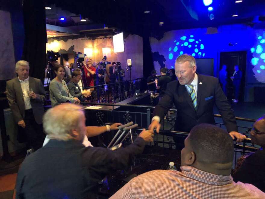 Mayor Buddy Dyer greets a supporter at his re-election launch party at the Abbey in downtown Orlando. Photo: Emily Lang, WMFE
