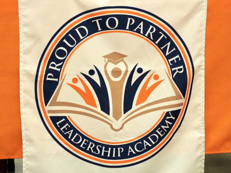 A banner bearing the Proud To Partner Leadership Academy logo hangs from a table at a board meeting at the charter school in southwest Oklahoma City on Nov. 18.