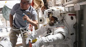 NASA astronaut Mark Vande Hei assists NASA spacewalker Thomas Marshburn in the U.S. Quest airlock before the beginning of a six-hour and 32-minute spacewalk to replace a faulty antenna system on the International Space Station's Port-1 truss structure. (NASA)