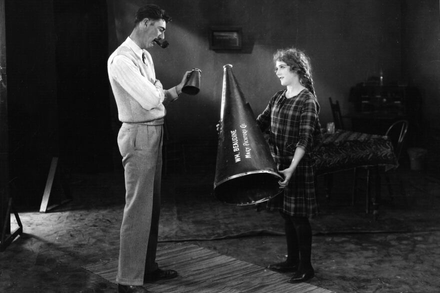Pickford and director William Beaudine pose on the set of 1925's <em>Little Annie Rooney</em>. According to scholar Cari Beauchamp, if Pickford clashed with her director, she was careful to criticize him in private, and not on the set.