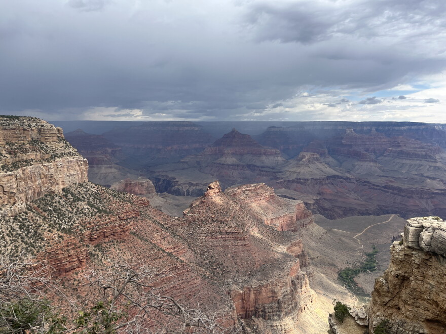Storm clouds form over the South Rim of the Grand Canyon, Aug. 31, 2026. More than a dozen people are still unaccounted for Monday following devestating flooding over the weekend.