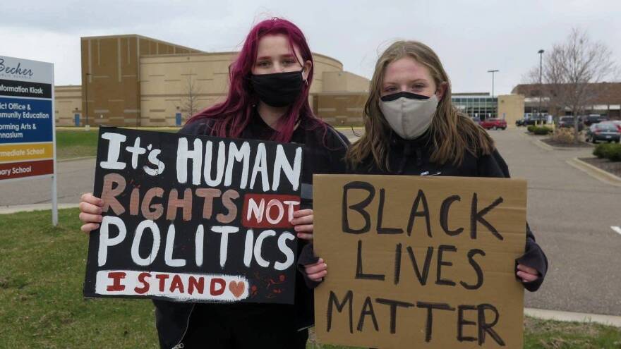 Erin Deering, left, and Anna Pancoast, both students at Becker High School, participated in Monday's walkout. Pancoast, a senior, helped organize it. "I was just trying to figure out ways I can help as a white straight woman living in a predominantly white community, and one that has a lot of bias towards people of color," she said.