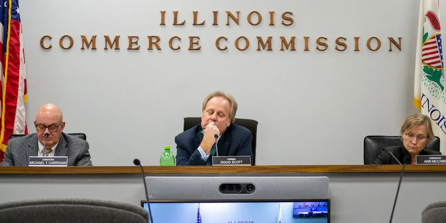 Illinois Commerce Commission Chair Doug Scott is pictured alongside commissioners Michael Carrigan (left) and Ann McCabe (right) at a November 2023 meeting in Springfield.