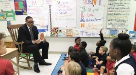 IPS Superintendent Lewis Ferebee reads to students.