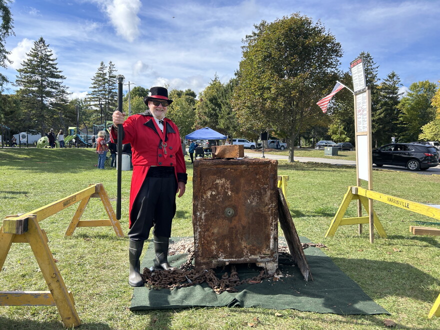 Ty Damon stands proudly in front of the century-old safe on September 20, 2026.