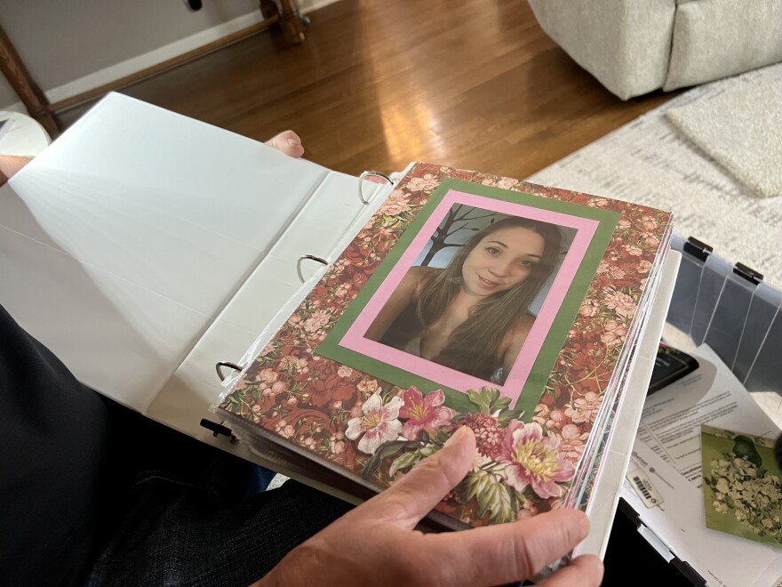 Ron Smith pages through a scrapbook of his daughter Tristin Kate Smith. She died by suicide in 2023.