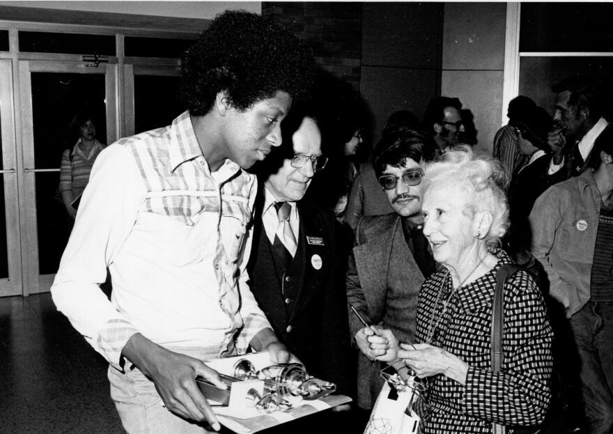 Jimmy Wilson chats with mathematician Nura Turner at the United States of America Mathematical Olympiad in 1978.