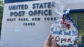 A cookie that says "Keep West Park PO Open." The West Park post office will close temporarily, and many residents fear the closure could be permanent.