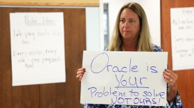Maria Gonzalez, a school phycologist with RCSD for 26 years, gathered with other union members to make posters to protest the RCSD contract with Oracle that has crated a payroll crisis for hundreds of teachers and support staff who are yet to be paid, paid correctly, paid on time, or have correct payroll deductions made. Union members gathered a the Rochester Teachers Association union offices to make the signs ahead of Thursdays action Infront of districts offices to protect the payroll isssues.