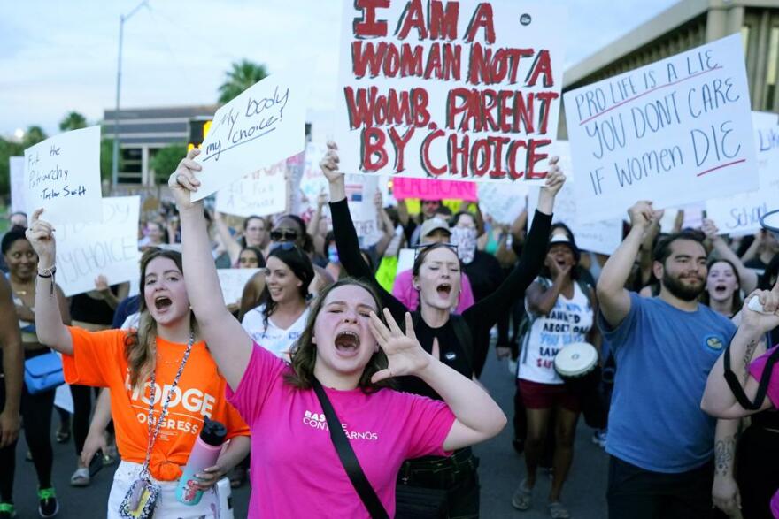 Protesters shout as they join thousands marching around the Arizona Capitol after the Supreme Court decision to overturn the landmark Roe v. Wade abortion decision Friday, June 24, 2022, in Phoenix. The Supreme Court on Friday stripped away women’s constitutional protections for abortion, a fundamental and deeply personal change for Americans' lives after nearly a half-century under Roe v. Wade. The court’s overturning of the landmark court ruling is likely to lead to abortion bans in roughly half the states.