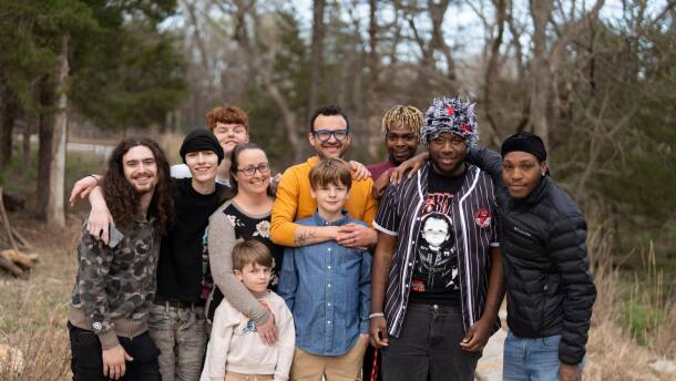 Jonathan and Katie Stahls' family consisting of biological children and several adopted foster children pose for a family photo.
