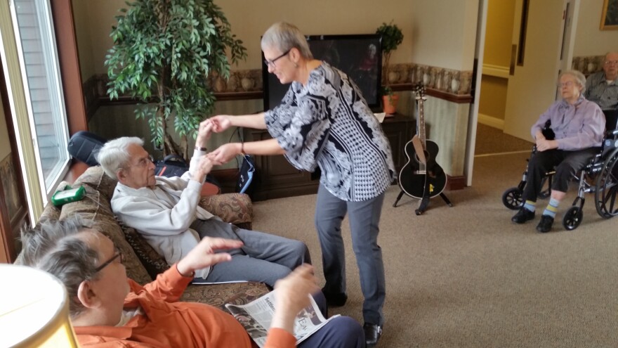 Mary Sue Wilkinson uses music as a way to connect and engage with residents at Orchard Creek Supportive Care.