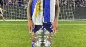 Facundo Torres stands behind the trophy after Orlando City defeated Sacramento Republic in the U.S. Open Cup final soccer match Wednesday, Sept. 7, 2022, in Orlando. (photo: Facundo Torres Twitter)