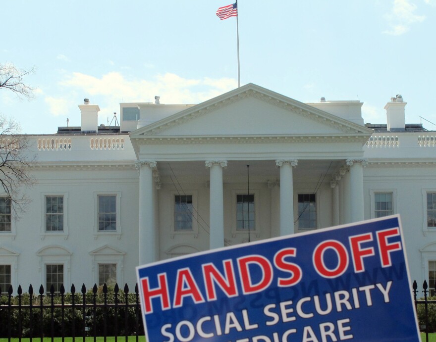 A sign outside the White House on Tuesday protests part of President Obama's proposed federal budget.