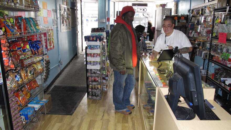 Communications store owner Donny Seto (right) says other business owners shouldn't be so hesitant to set up in the Congress Heights neighborhood of Washington, D.C.