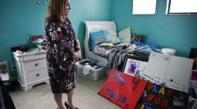 Lori Alhadeff, mother of 14-year-old Alyssa Alhadeff who was one of 17 people killed at Marjory Stoneman Douglas High School, stands in her daughter's bedroom on Wednesday, Jan. 30, 2019, in Parkland, Fla. Much of the teenager's turquoise-colored bedroom remains untouched. (Brynn Anderson/AP)