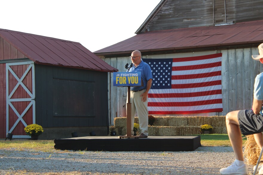 Patrick Cortesi speaking at podium at McLean County Democratic Party event