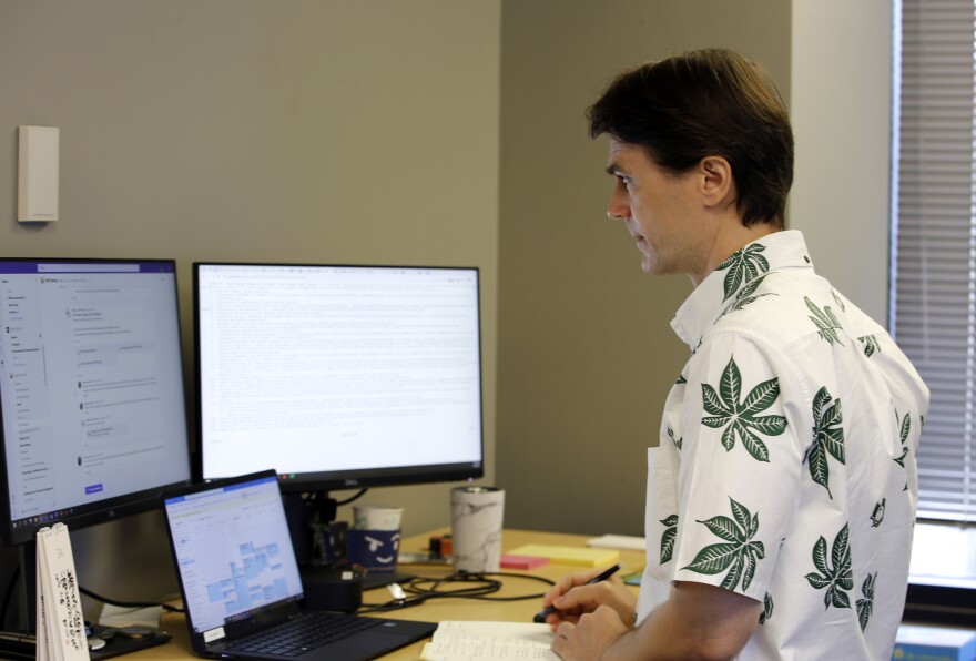 Scott Glenn, the state of Hawaiʻi's Chief Energy Officer, works in his office on Wednesday, Aug. 24, 2022, in Honolulu. As Hawaiʻi transitions toward its goal of achieving 100% renewable energy by 2045, the state's last coal-fired power plant closed on Sept. 1 ahead of a state law that bans the use of coal as a source of electricity beginning in 2023. (AP Photo/Caleb Jones)