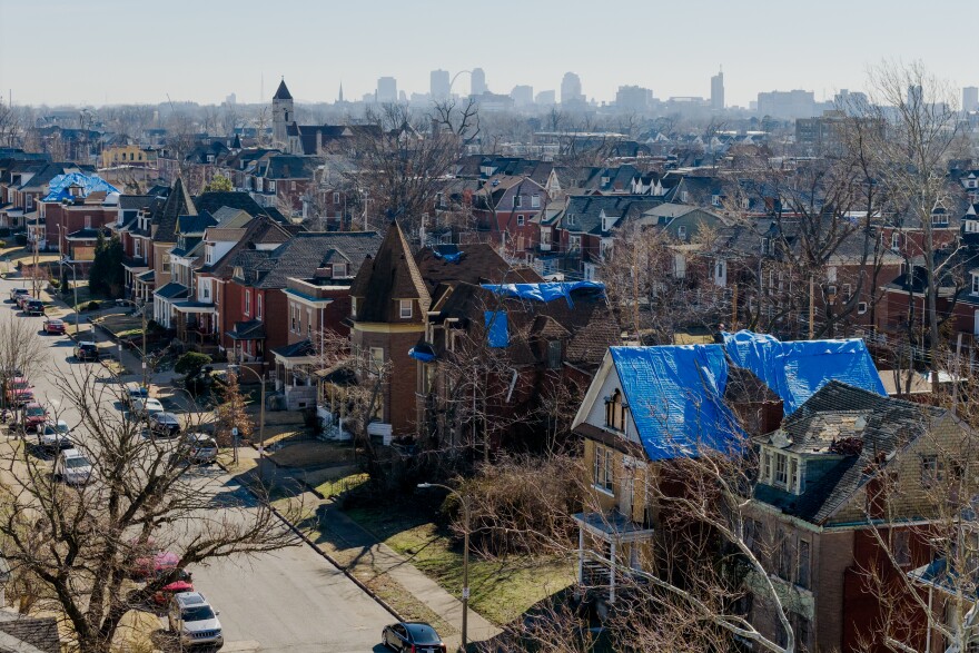 Tarps line tornado-damaged homes on Feb. 27 in north St. Louis.