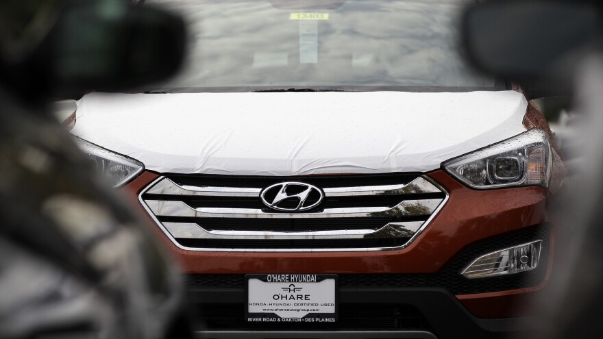 A Hyundai Sonata sits in a Hyundai car dealership in Des Plaines, Ill., in 2012. U.S. auto safety regulators have stepped up a series of investigations into engine fires that have plagued Hyundai and Kia vehicles for more than six years.