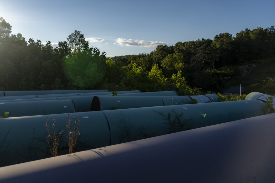 Pipes that have been sitting for four years on the property of impacted landowner Maury Johnson, in Greenville, W.Va., on Thursday, Sept. 1, 2022.