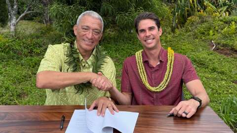 Maui County Mayor Richard Bissen, left, and Maui Land & Pineapple Company CEO Race Randle, right, have signed a memorandum of understanding for the county's acquisition of key West Maui water systems.