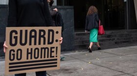 People make their way into the Mark O. Hatfield United States Courthouse on Friday, Oct. 3 in Portland, Ore. The state of Oregon and the city of Portland will appear in federal court at 10 a.m. for a hearing on their motion to block President Trump's deployment of the National Guard.