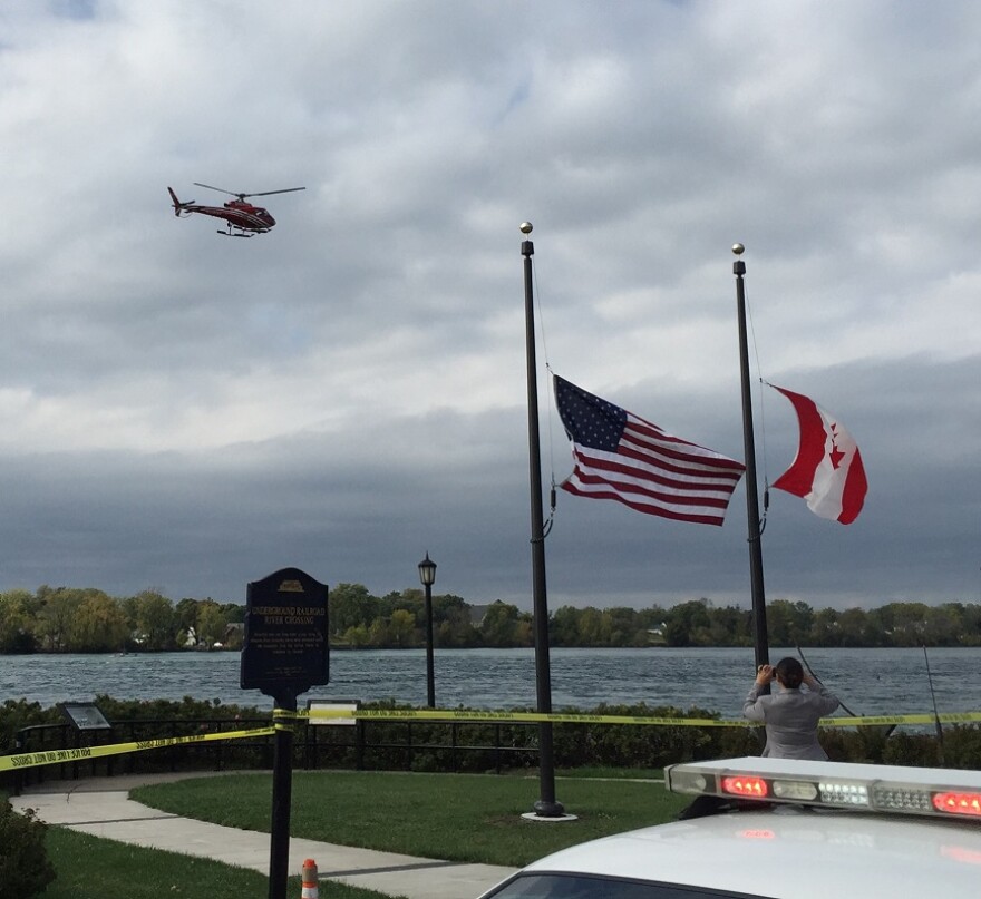 Erie County Sheriff's Air One flies low and near the shoreline as part of an extensive search Friday afternoon for a missing Buffalo Police diver.