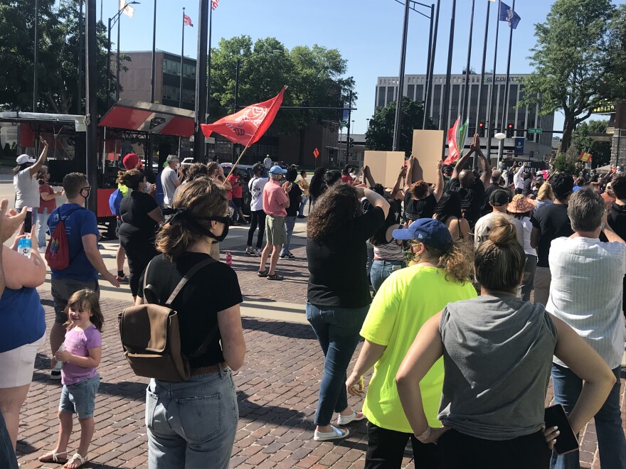 About 100 people participated in a small demonstration in Kansas City, Kansas, Sunday afternoon. Thousands more turned up at the Plaza to protest the deaths of black men and women in police custody.