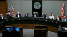 People sitting around a dais