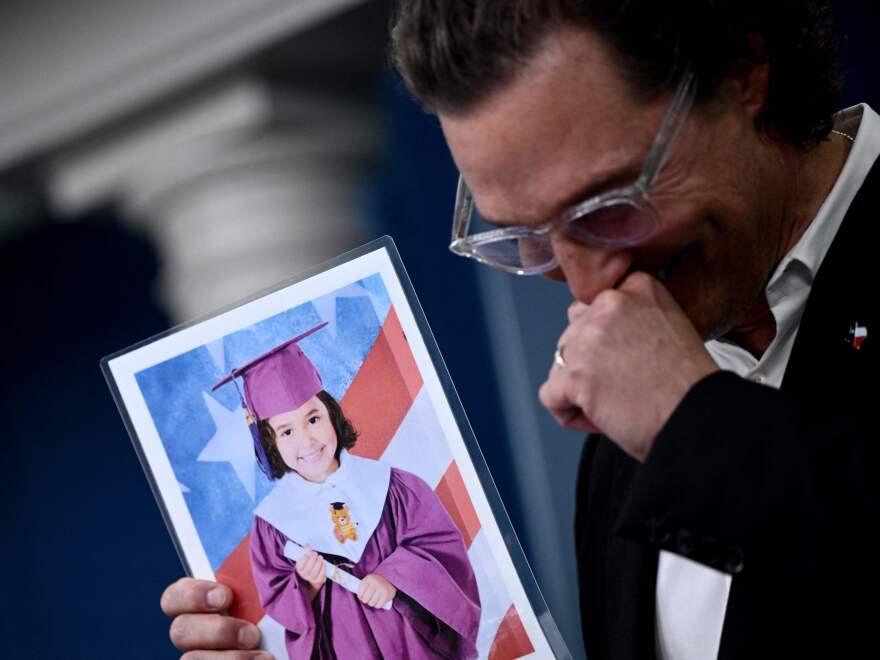 Actor Matthew McConaughey chokes up as he holds a photo of Alithia Ramirez, a 10-year-old student who was killed in the mass shooting at Robb Elementary School in his native Uvalde, Texas, while speaking during the daily press briefing at the White House on Tuesday. McConaughey has been meeting with senators to discuss gun reform.