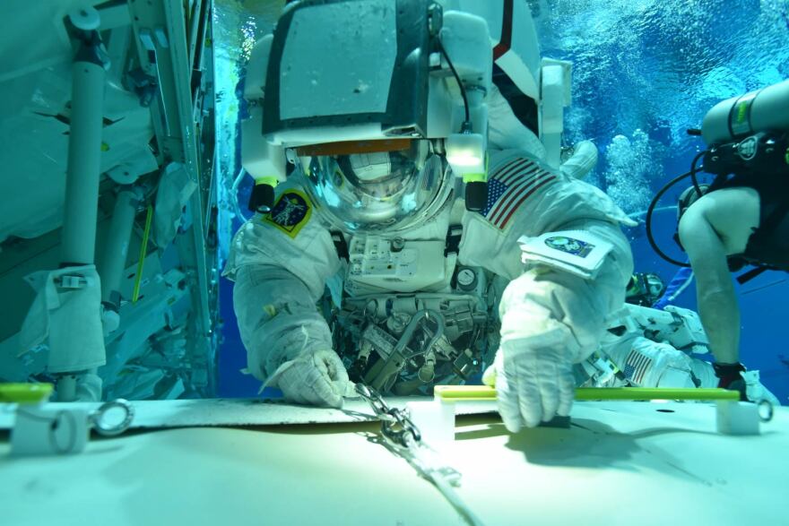 Tess Caswell suits up in the Extravehicular Mobility Unit at the Neutral Buoyancy Laboratory at NASA’s Sonny Carter Training Facility in Houston during training to become an EVA instructor.