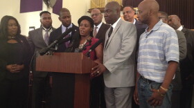 Joined by her Attorney Ben Crump and others, Brittany Jacobs speaks during a news conference inside a Tallahassee church prior to a march to the capitol Wednesday.