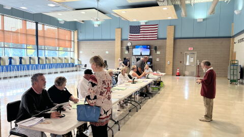 File: Poll workers at Westerly Middle School. Credit: David Wright/Ocean State Media