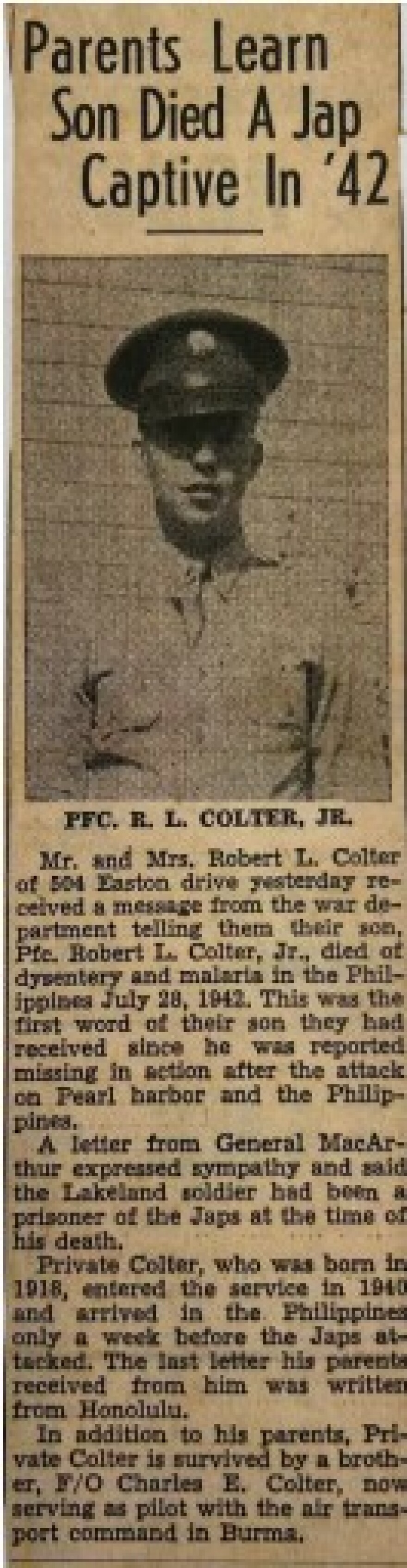 A yellowed newspaper clipping with a soldier's head shot and headline: Parents Learn Son Died A Jap Captive In '42