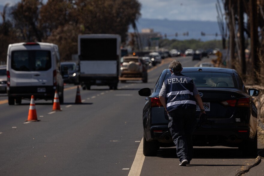 A Federal Emergency Management Agency official in the aftermath of the Maui wildfires in Lahaina, Hawaii, on Aug. 18, 2023. Even before social media, FEMA's manuals emphasize the importance of getting reliable information out to reduce the impact of rumors.