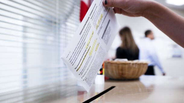 A voter casts their ballot on the first day of early voting at the Hamilton County Board of Elections, Wednesday, Oct. 10, 2018, in Cincinnati. In-person voting has begun in swing-state Ohio for the Nov. 6 elections for governor, U.S. Senate, House seats and a host of other state and local offices and issues. Registration closed Tuesday, and county voting centers opened Wednesday morning.